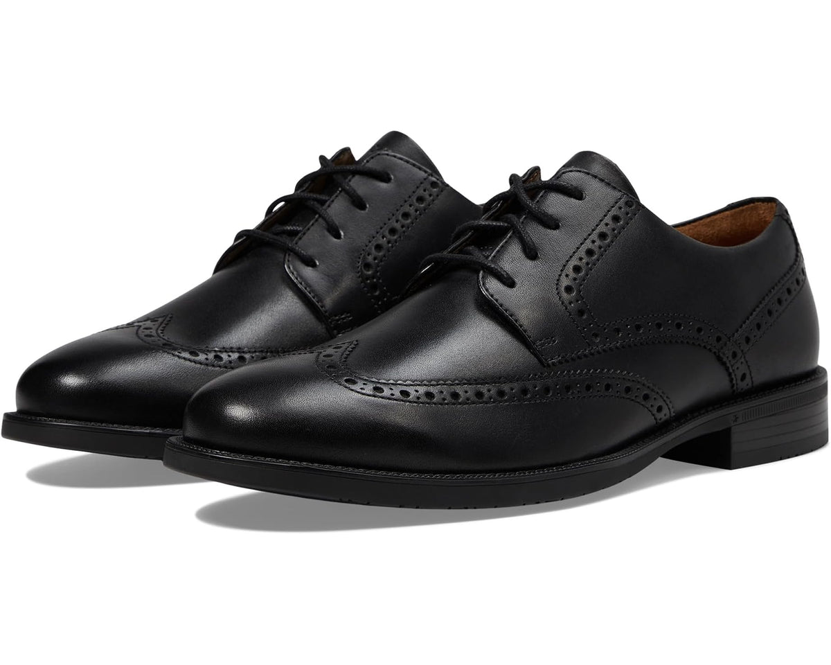 Black leather wingtip oxford shoes with lace-up and brogue detailing