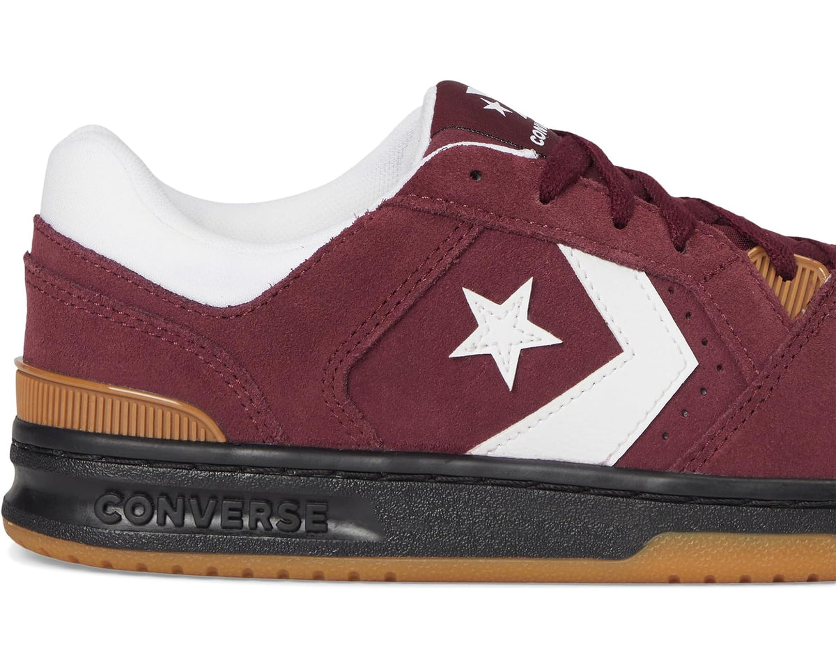 Burgundy suede sneaker with white star, black midsole, gum outsole