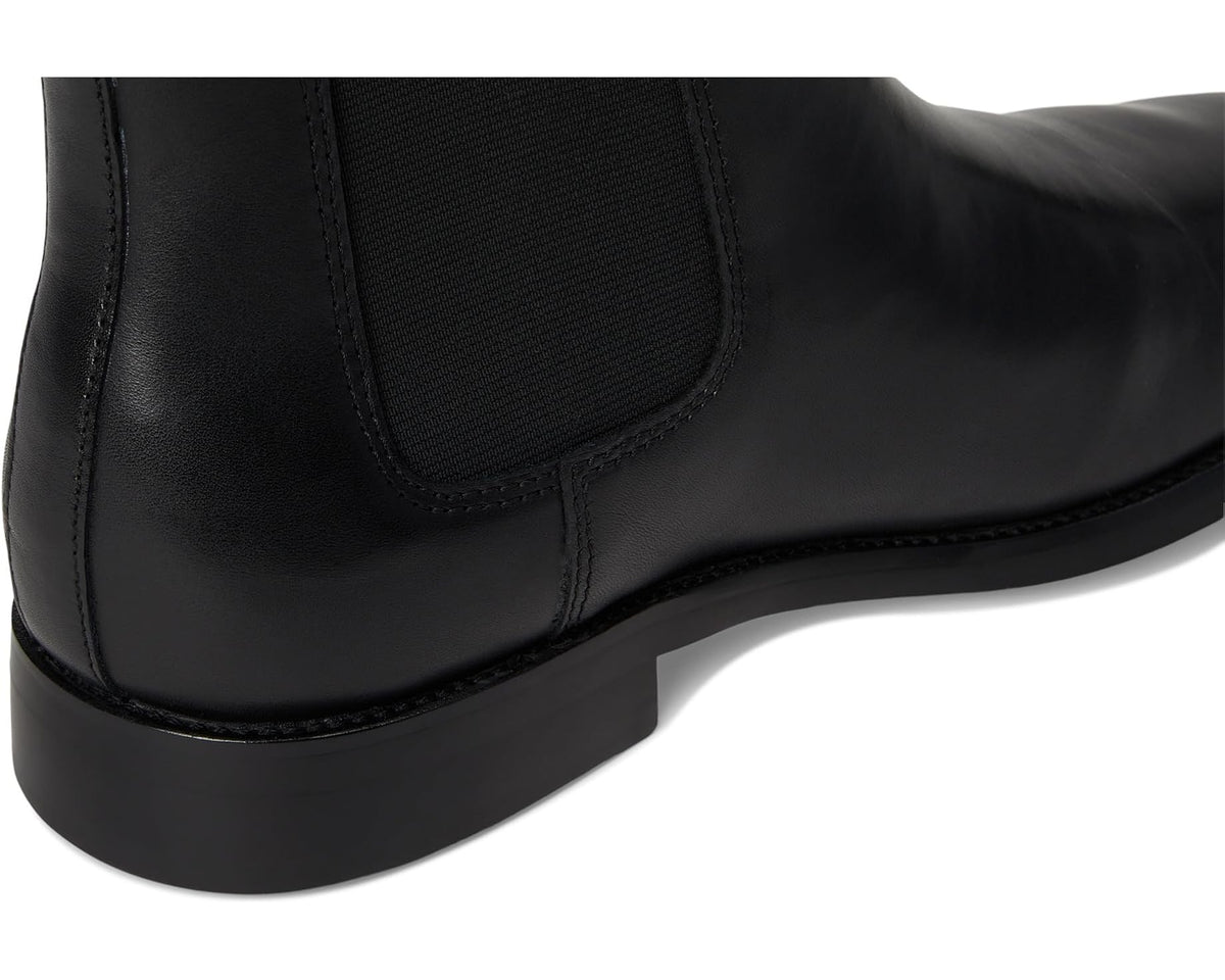 Black Chelsea boot heel area with elastic gore and leather stitching