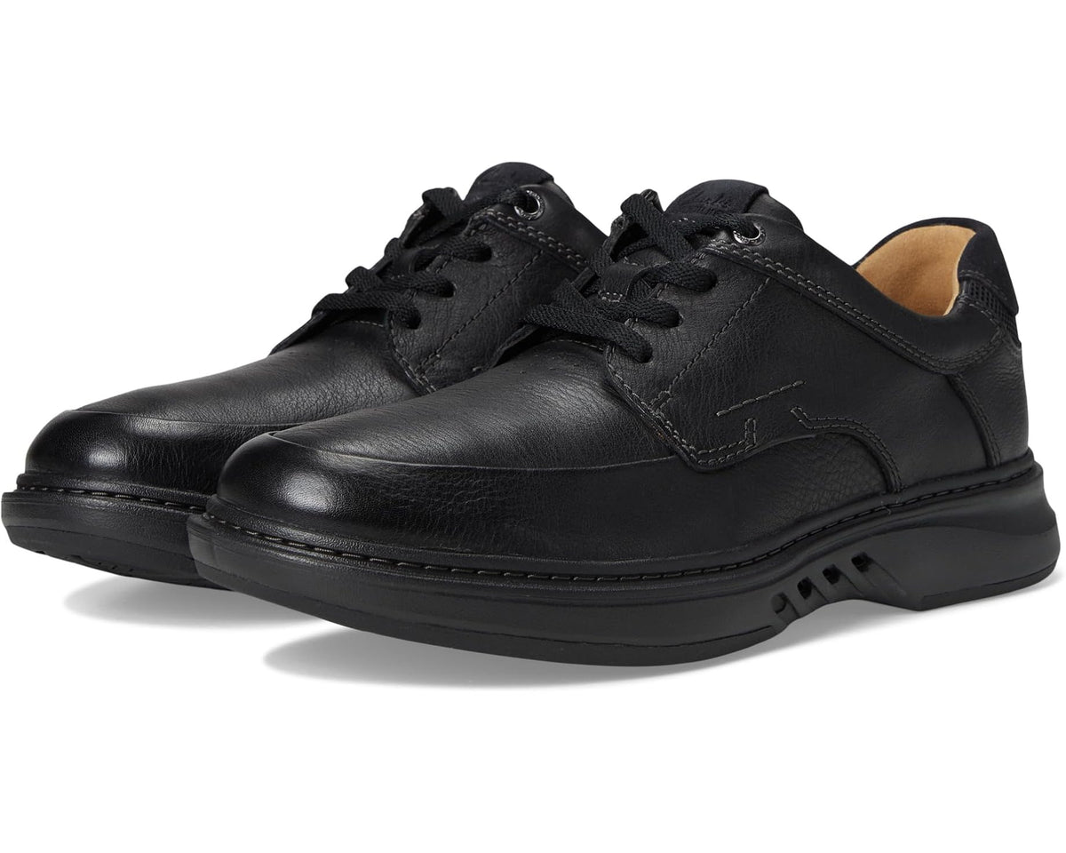 Men's black leather lace-up Oxford shoe with stitched apron and padded collar.