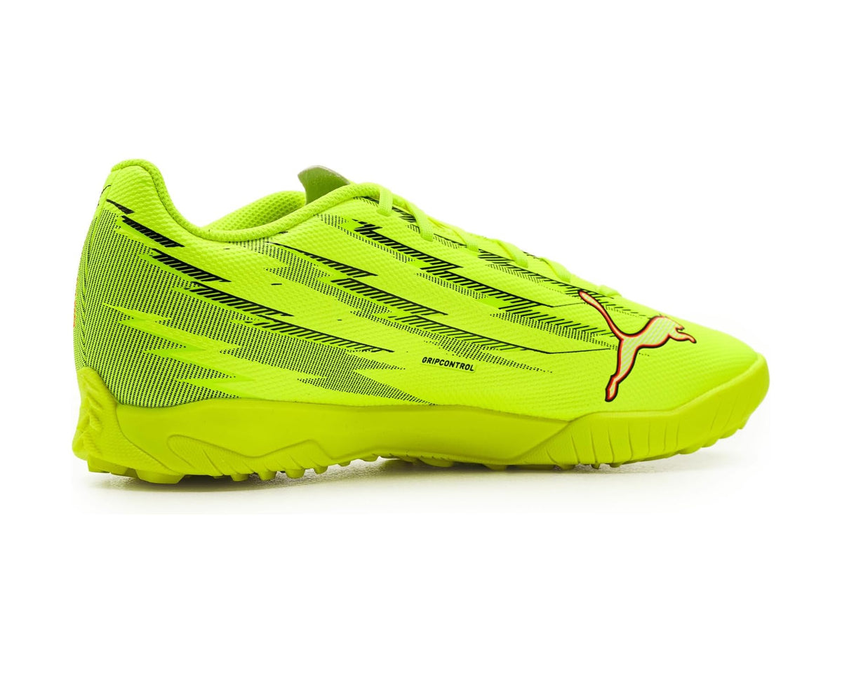 Neon yellow PUMA turf soccer cleat, side view with patterned upper and red accents