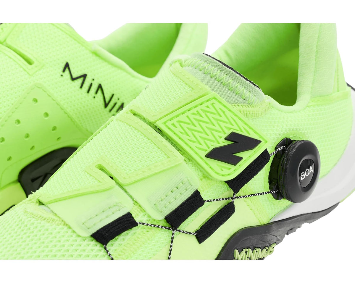 Close-up of men's neon green training shoe with black straps and BOA dial