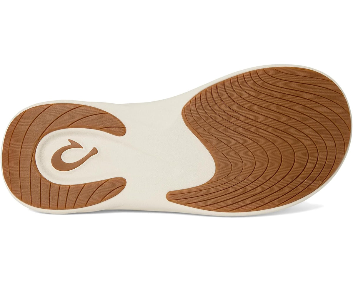 Men's OluKai flip-flop outsole with brown tread and white traction pods