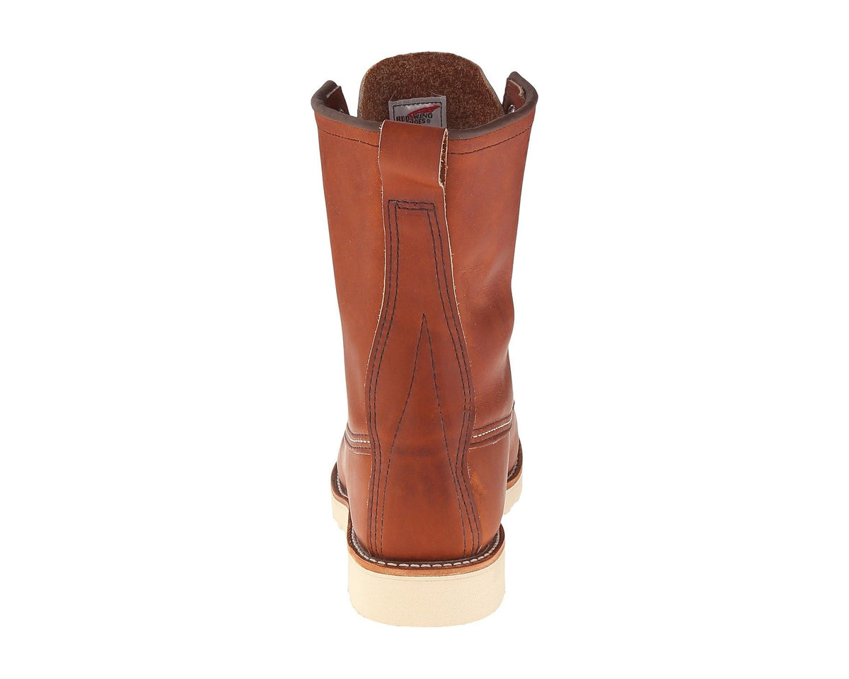 Red Wing Heritage men's moc-toe boots from heel view, brown leather and cushioned lining