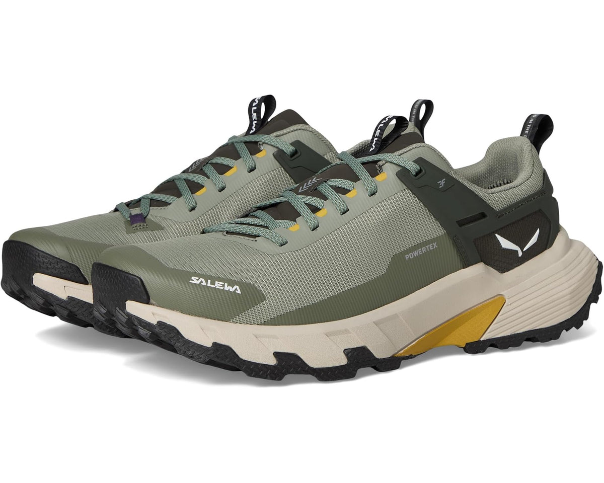 Men's olive and dark gray trail shoes with yellow accents and chunky tread sole
