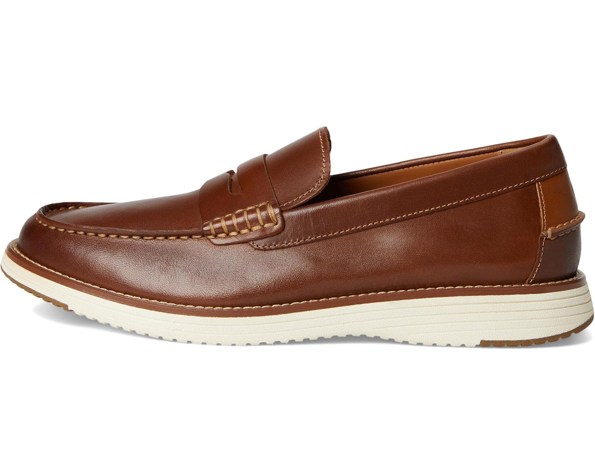 Men's penny loafer side profile, brown leather upper with penny strap and stitch trim