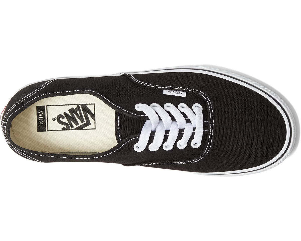 Vans low-top sneakers side view, black canvas with white lace eyelets and Sidestripe