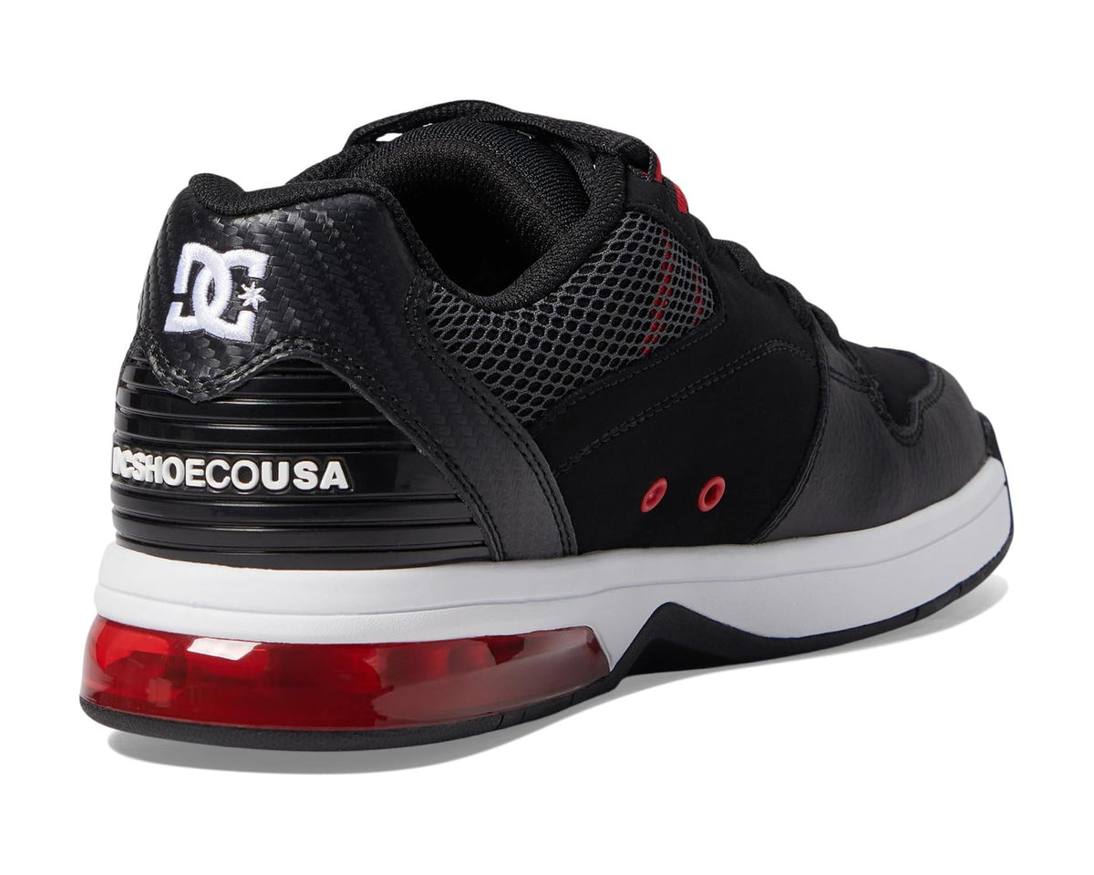 Black DC skate sneakers with mesh upper, white heel tag, and red outsole strip.