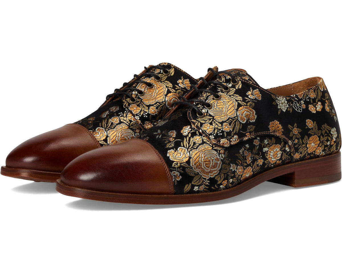 Men's jackshoe with dark floral embroidery, brown leather toe, low-profile heel.