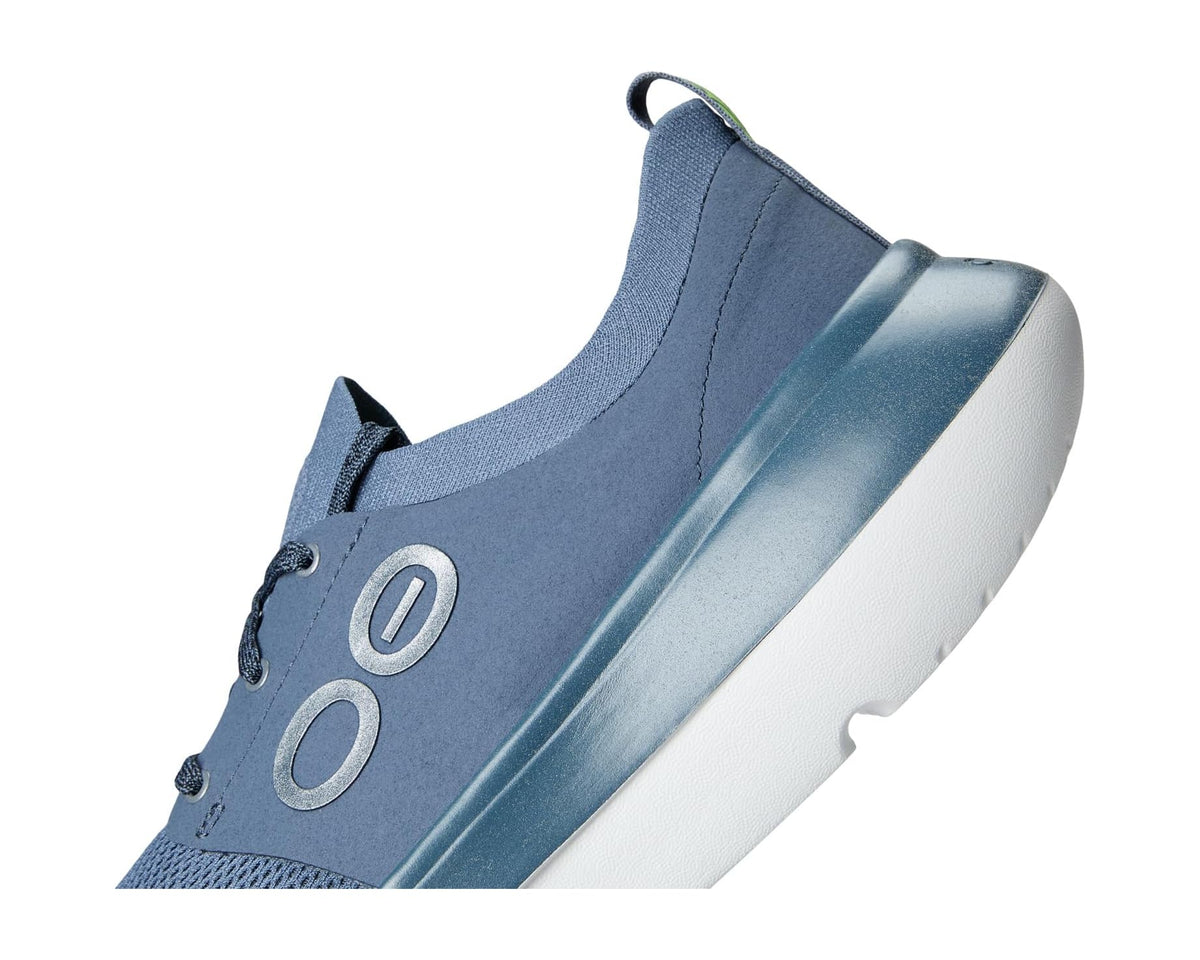 Men's OOFOS OOmy Stride sneakers, side view with textured sole and Moroccan Blue upper