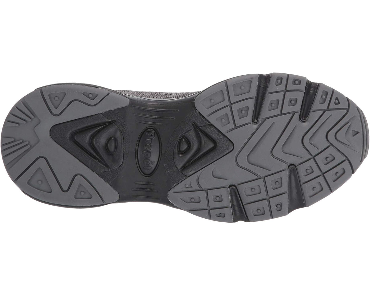 Men's Propet Stability Fly sneaker outsole with patterned rubber tread on dark base