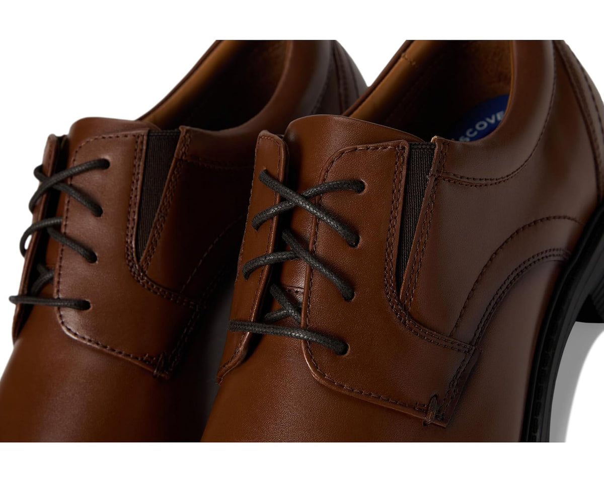 Brown leather lace-up oxford shoe close-up of eyelets and side panel