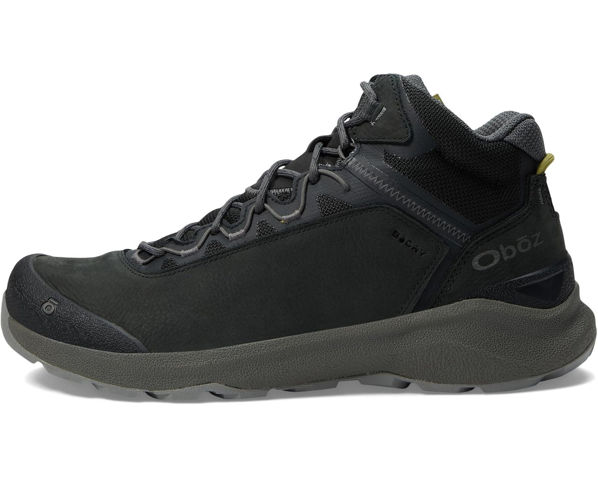 Men's mid-top hiking boot side view in dark gray/black with ankle strap and logo