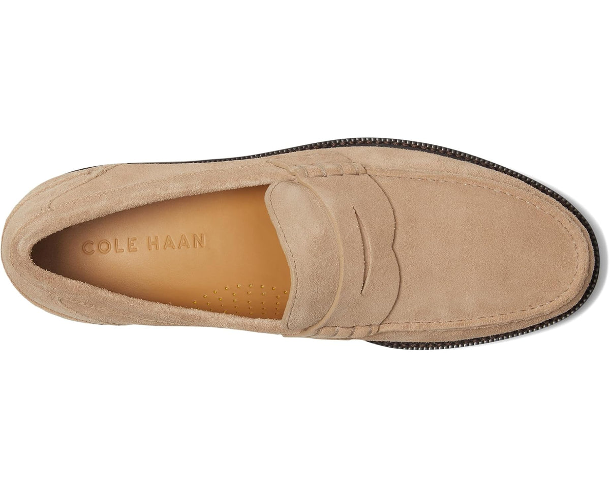 Suede penny loafer with Cole Haan logo on tan insole and moc toe