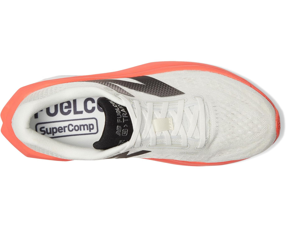 New Balance FuelCell trainer shoe, white upper with black logo and orange trim at toe