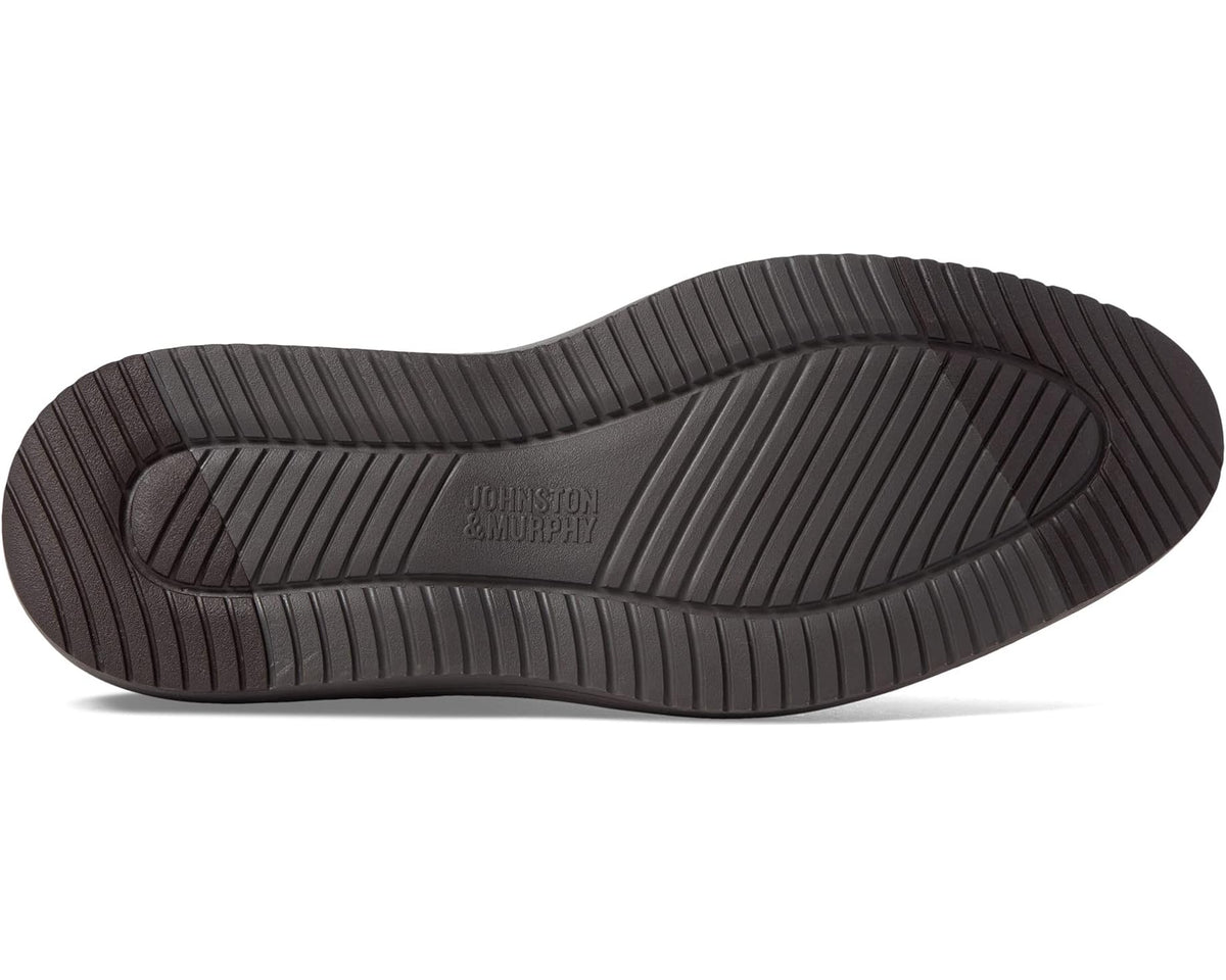 Chelsea boot outsole with Johnston & Murphy branding and deep tread grooves