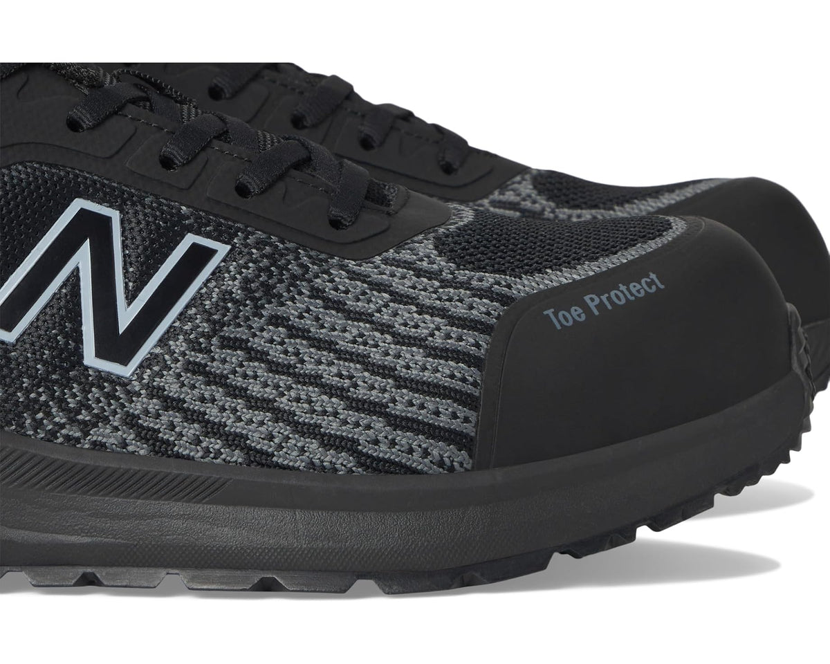 Close-up of black safety-toe work shoe upper with Toe Protect panel and New Balance N
