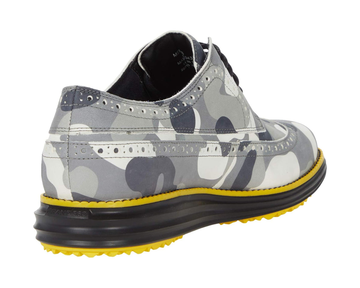 Gray camo golf oxford shoe heel view with black lining and yellow-rimmed sole