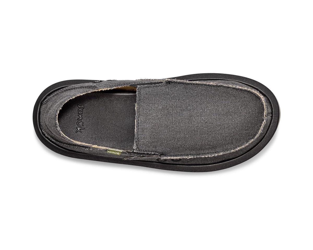 Charcoal slip-on shoe top view with tan lining and green logo label