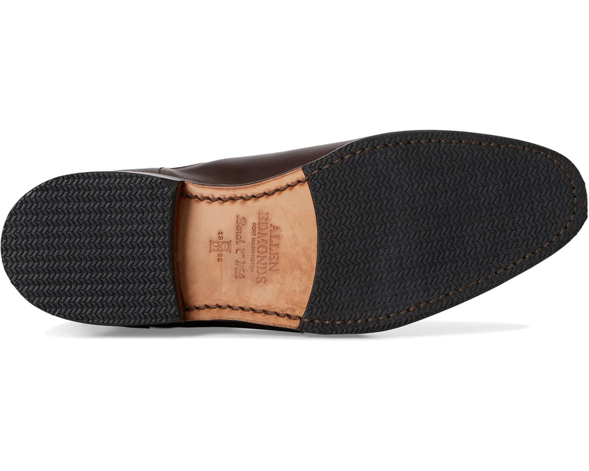 Chelsea boot outsole view with textured traction and leather welt