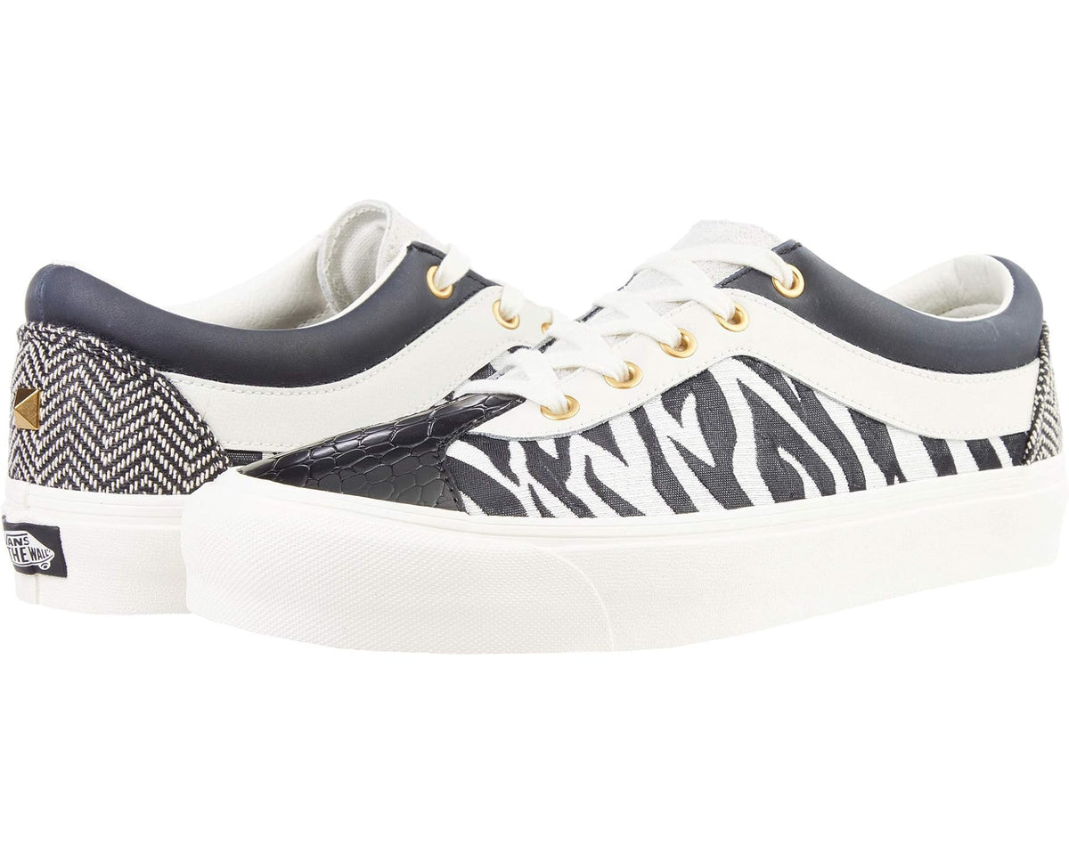 Unisex zebra-print low-top skate shoes with white laces, gold eyelets, navy heel