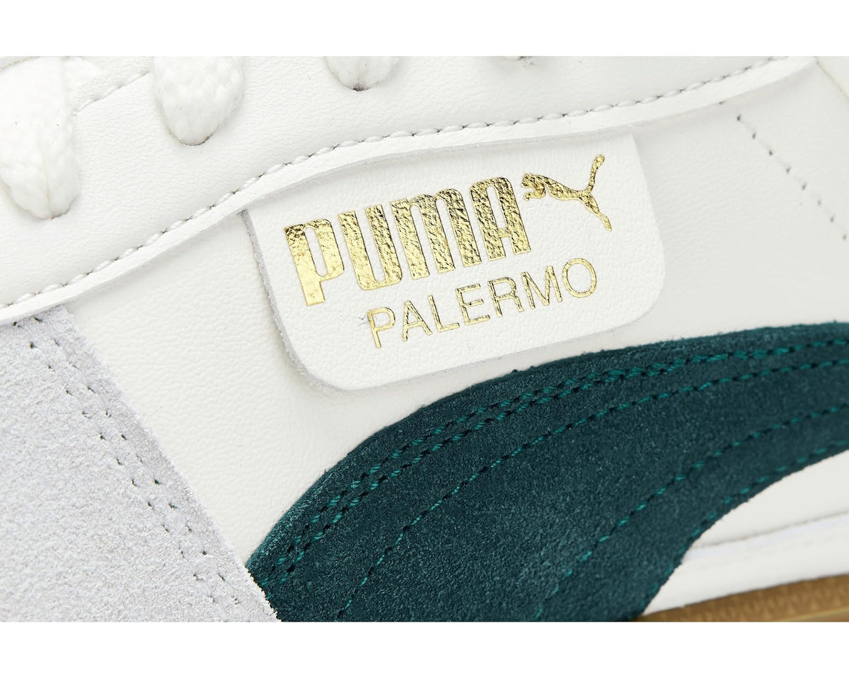 PUMA Palermo tongue label in gold on white sneaker upper with dark green stripe