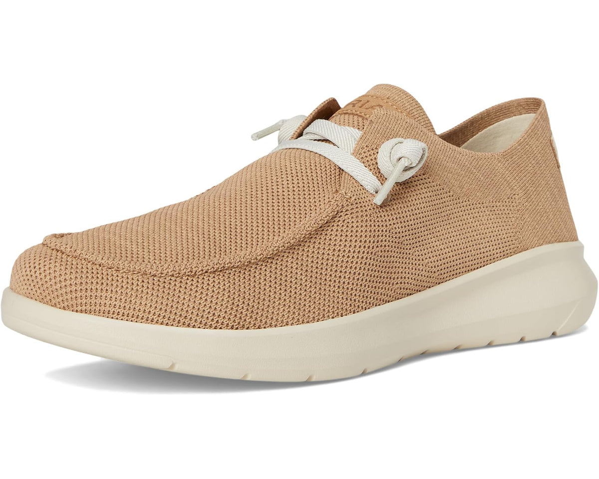 Light tan knit slip-on sneaker with white lace trim and low profile sole