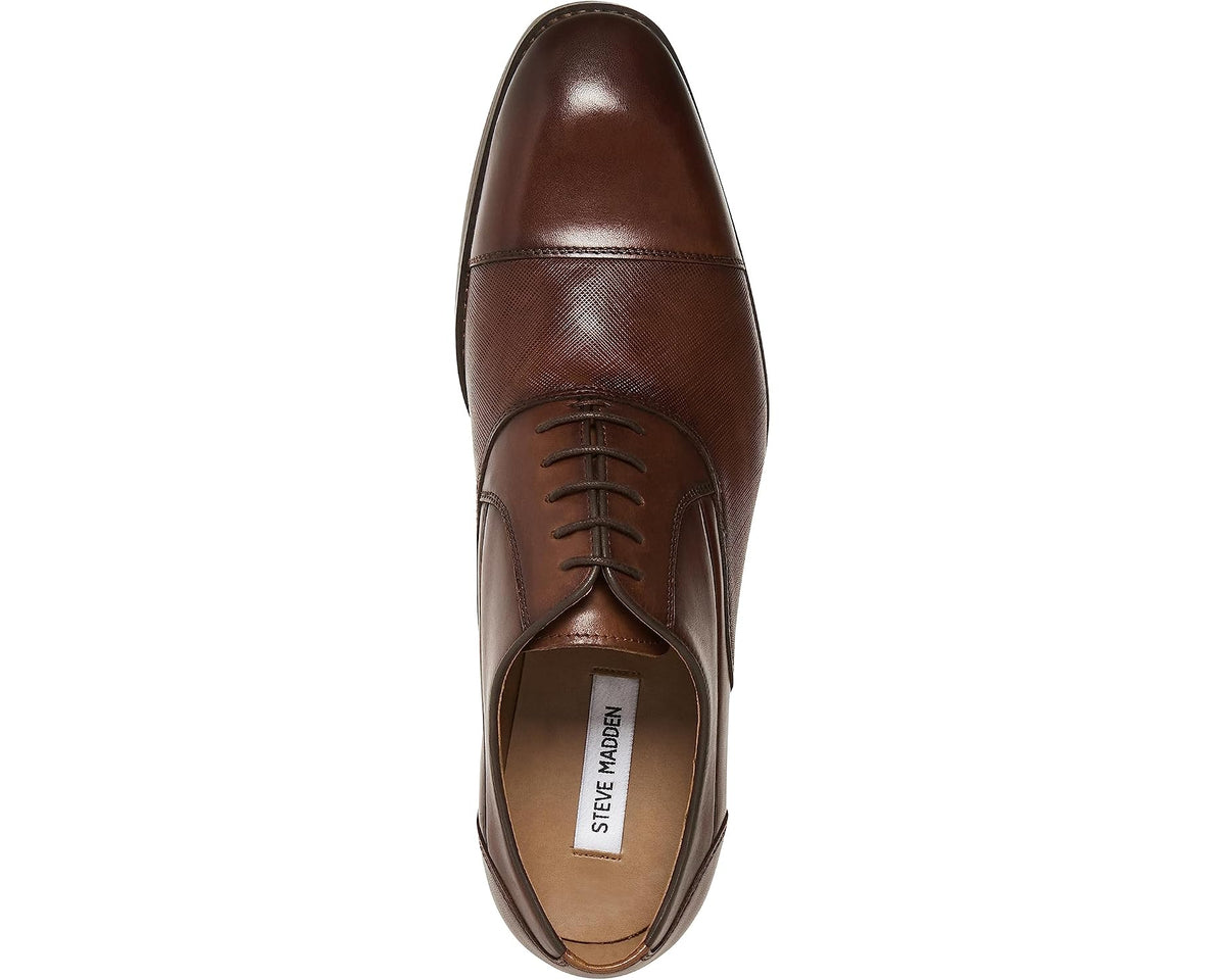 Tan leather Oxford dress shoe with lace-up front and metal eyelets.