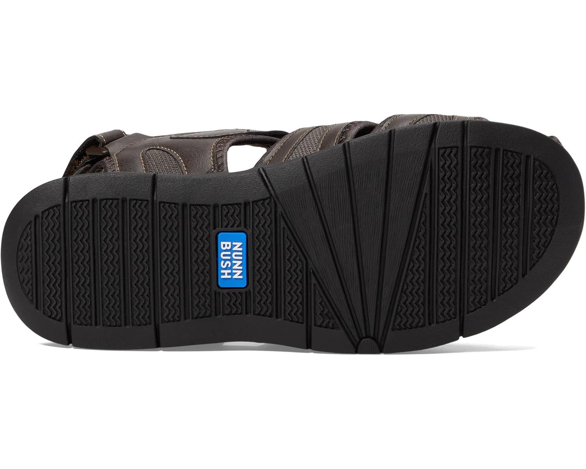 Closed-toe sandal outsole with textured tread and NUNN BUSH logo patch