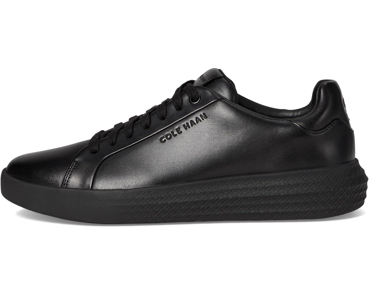 Men's black Cole Haan low-top sneakers with lace-up front and round toe