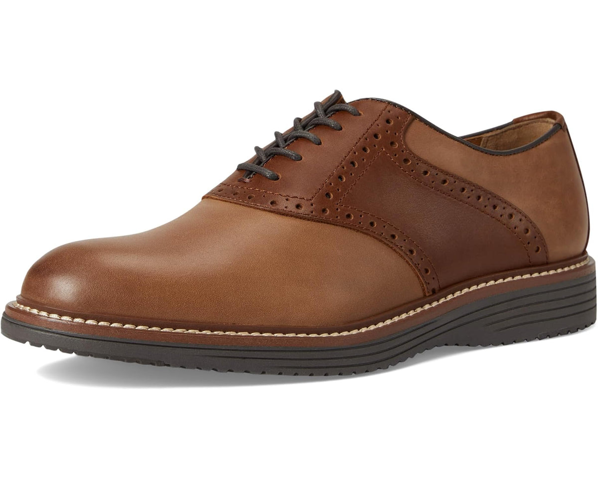 Saddle tan leather lace-up oxford shoe with wingtip brogue and stacked rubber sole