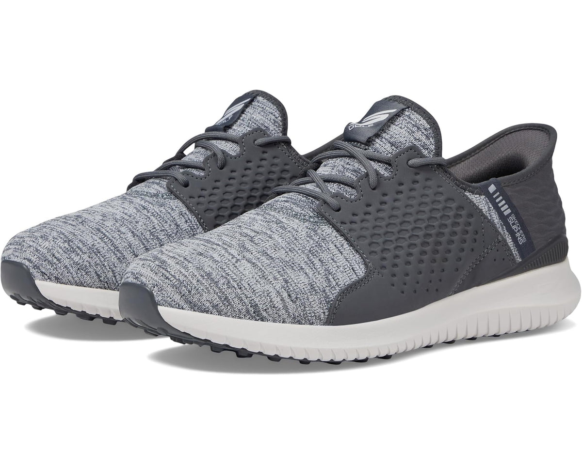 Men's grey slip-on golf sneakers with textured knit upper and lace-up closure
