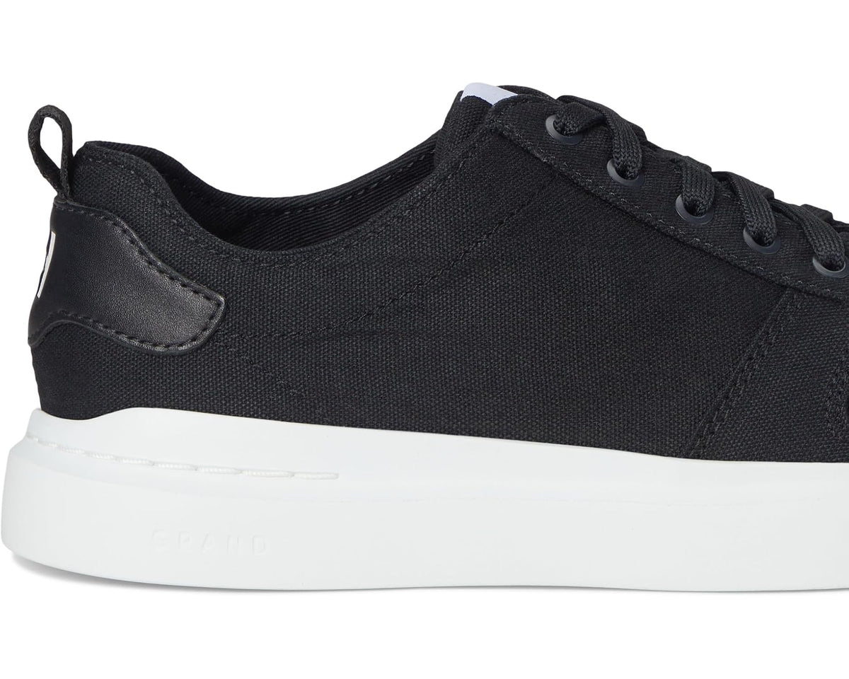 Black canvas low-top sneaker with lace-up top and white midsole
