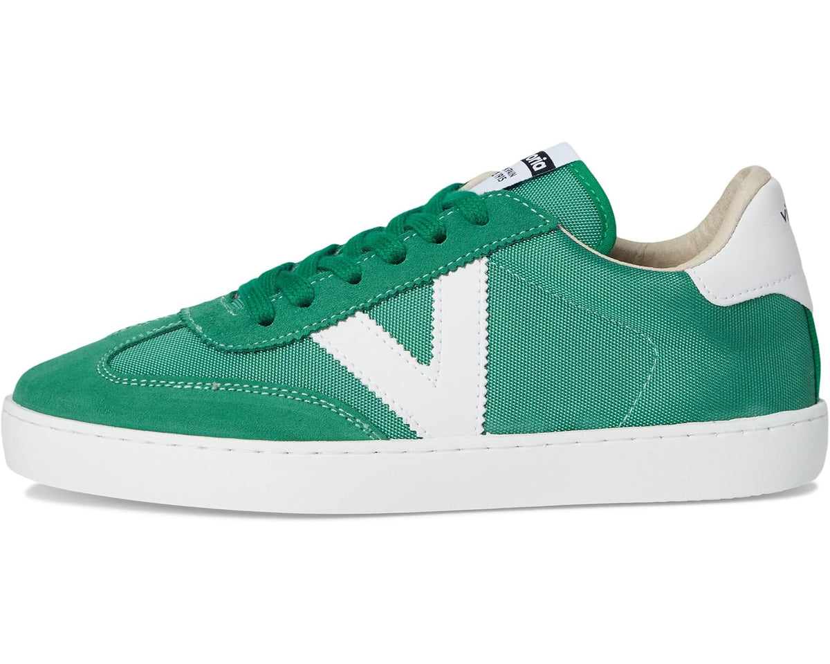 Green low-top sneakers with white V panel, lace-up front, and white rubber sole