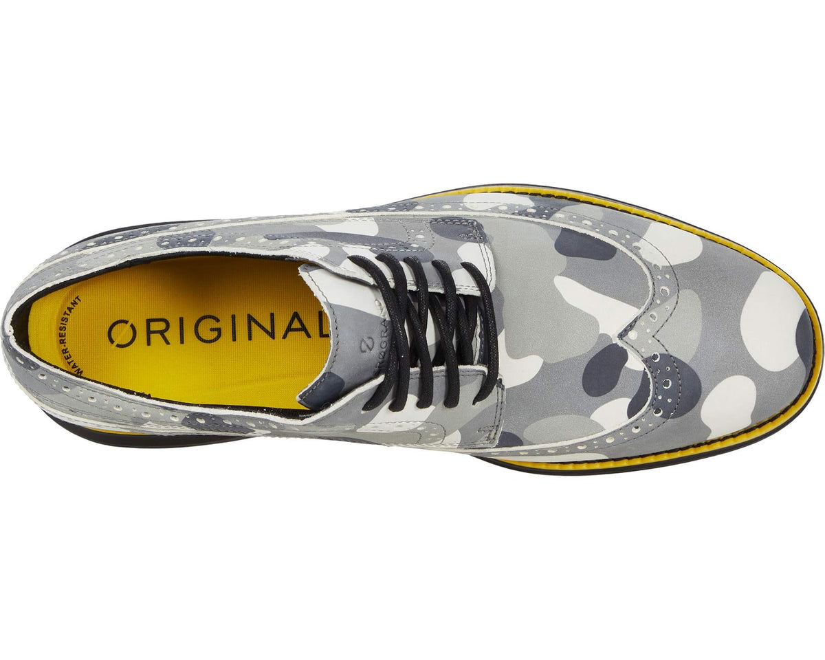 Gray camo golf oxford shoe, side view with lace-up front and yellow-trimmed sole