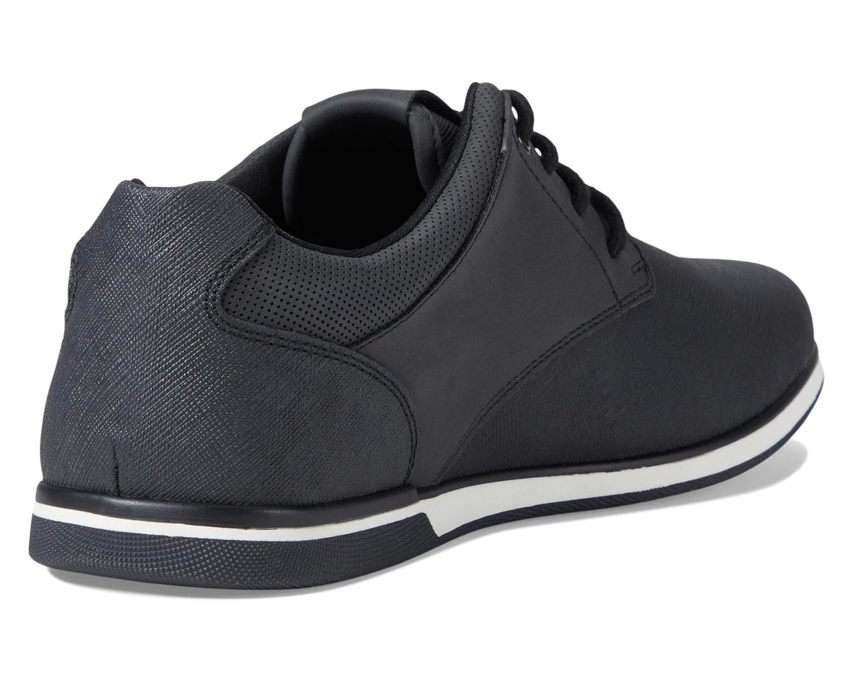 Black low-top sneakers with perforated panel, padded collar, and white sole edge