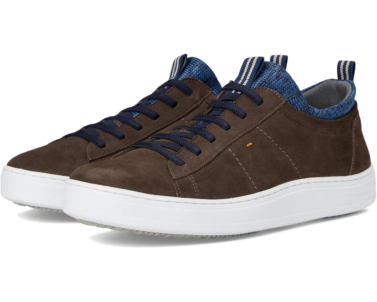 Walnut brown suede low-top sneakers with blue knit collar and lace-up, white sole.