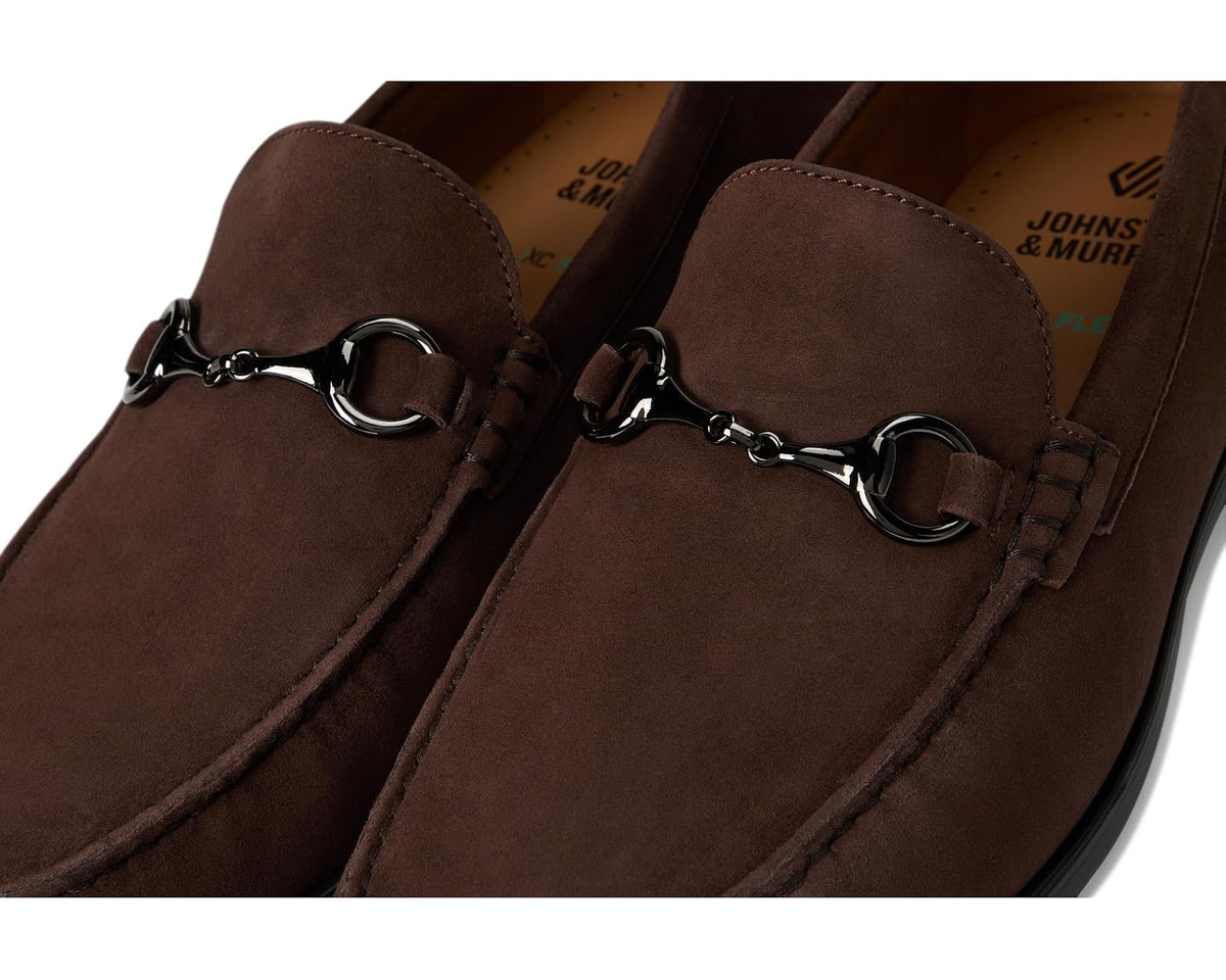 Close-up of dark brown suede loafer with metal horse-bit hardware