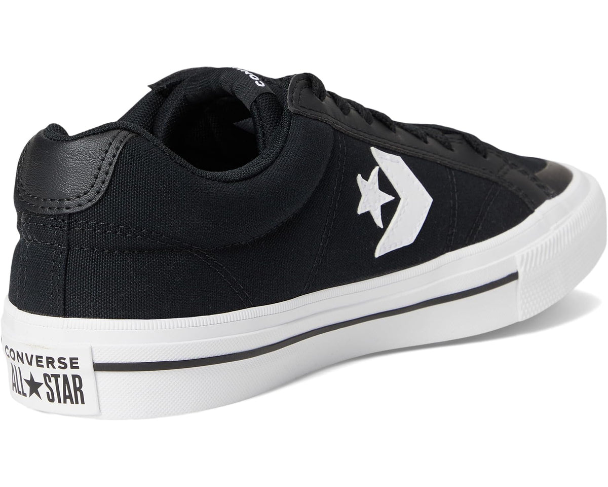 Black Converse sneaker with cushioned collar, lace-up front, and white midsole