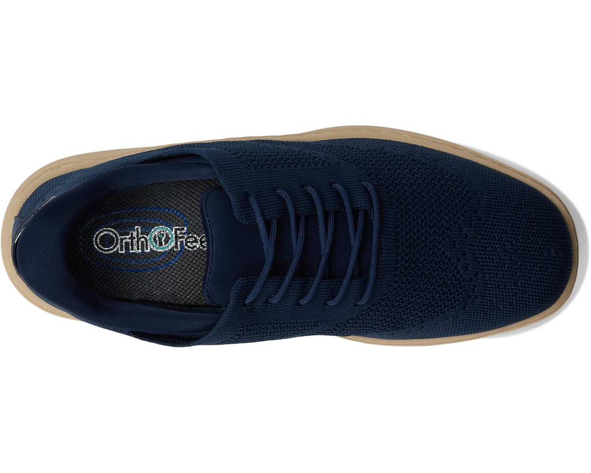 Navy blue lace-up knit sneaker view of footbed and Orthofeet logo on lining