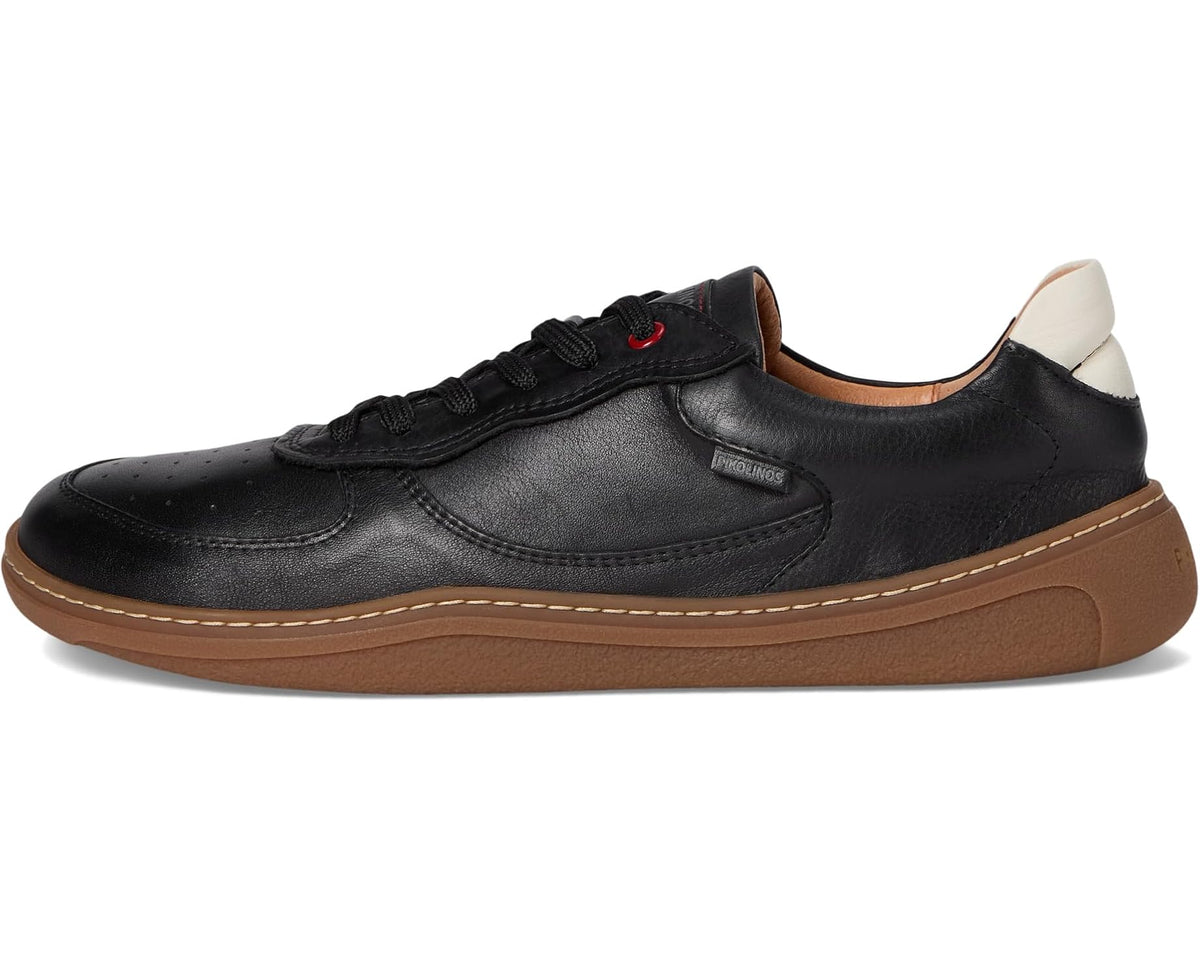 Black unisex lace-up sneakers with tan sole and padded collar