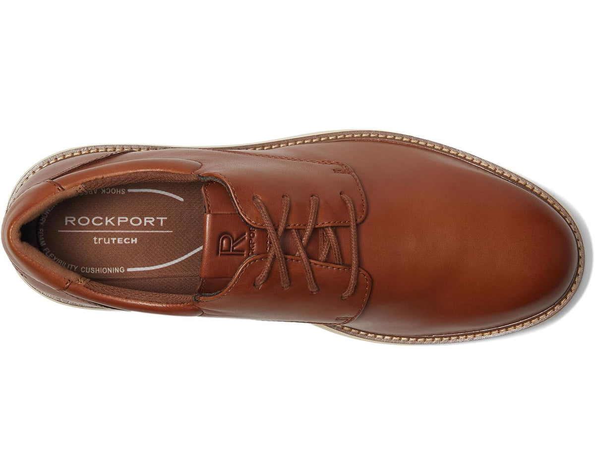 Men's brown leather lace-up oxford shoe, side view with stitched trim