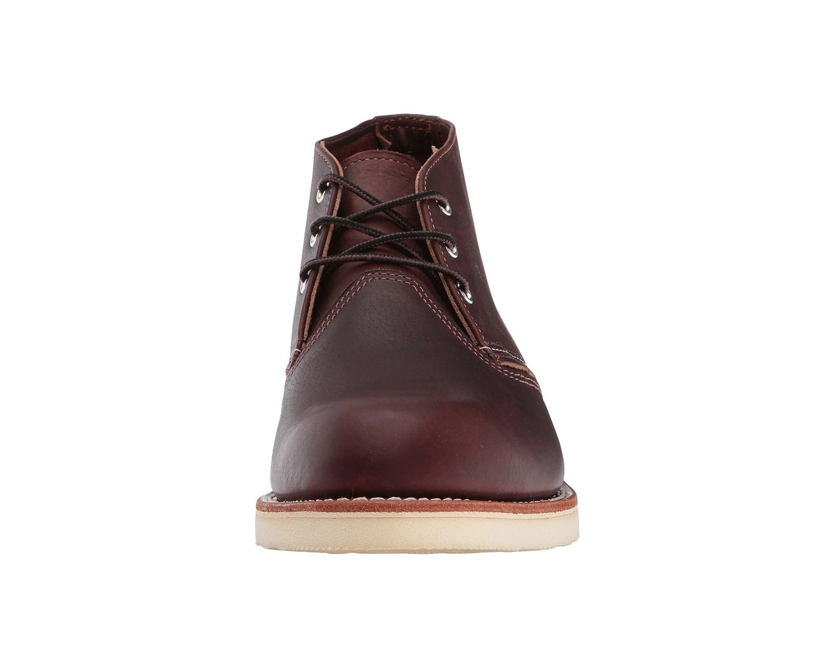 Brown leather chukka boot, front view, lace-up with metal eyelets