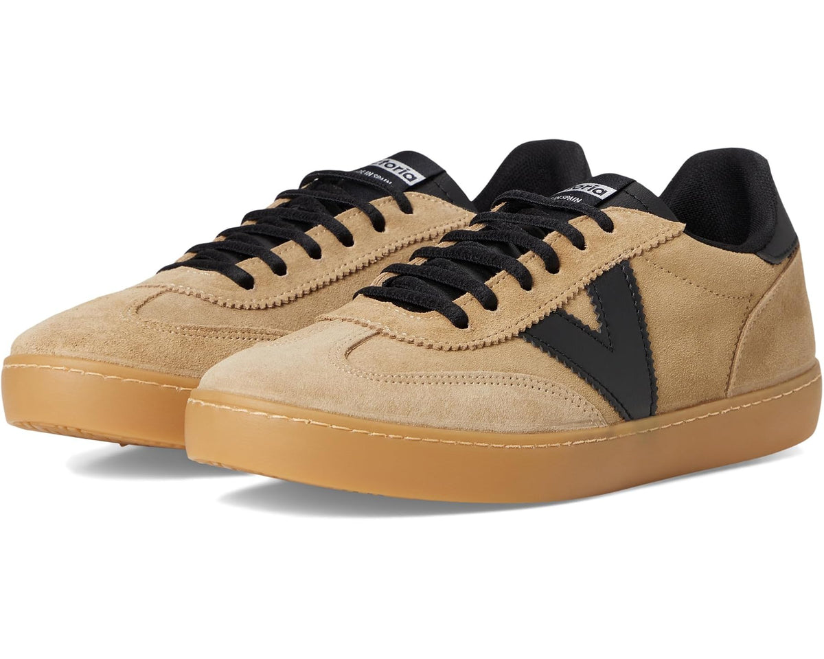 Beige low-top leather sneakers with black side panel and lace-up front