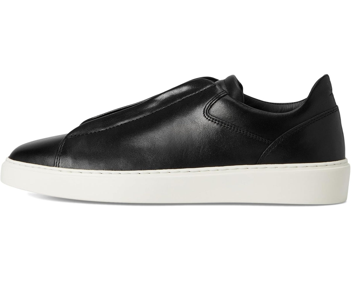 Black leather low-top sneaker with stitched side panel and white rubber sole.