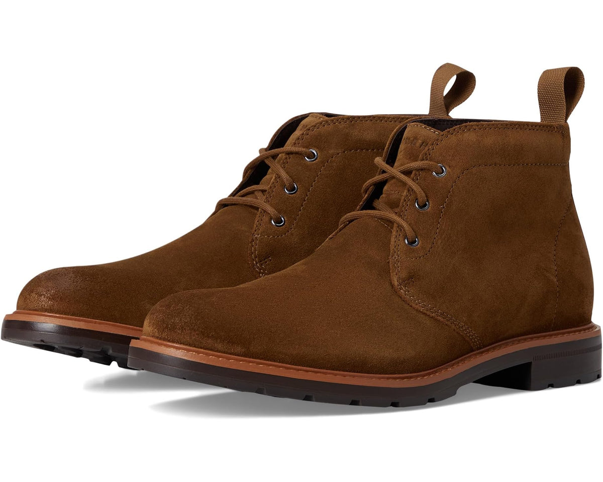 Men's brown nubuck chukka boots with lace-up eyelets and ankle collar pull tab