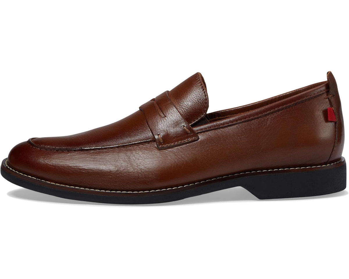 Men's brown leather slip-on loafer with red accent tab and contrast stitching