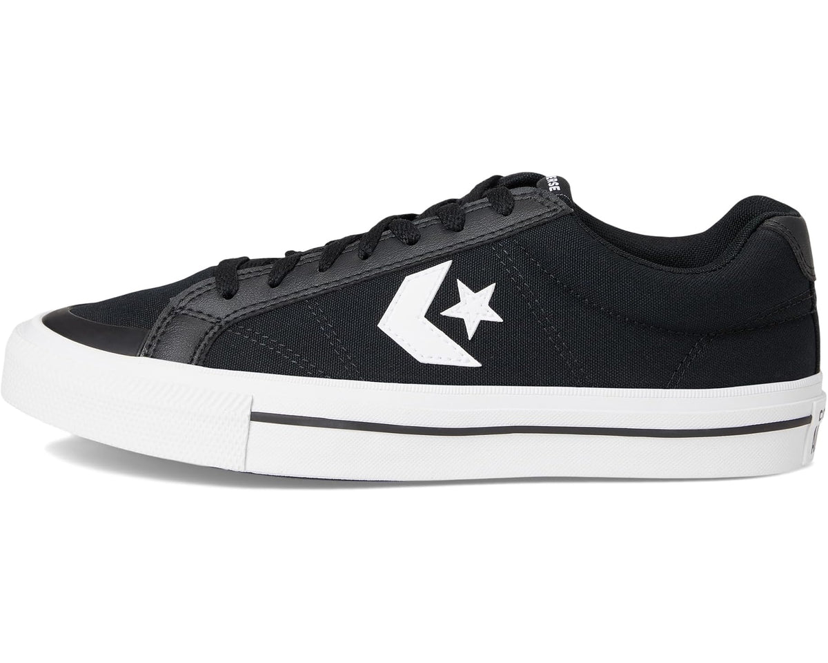 Black low-top Converse sneaker with white star logo and flat white stripe midsole