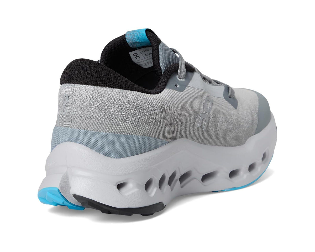 Light gray trail shoe with blue outsole edge and cushioned heel collar