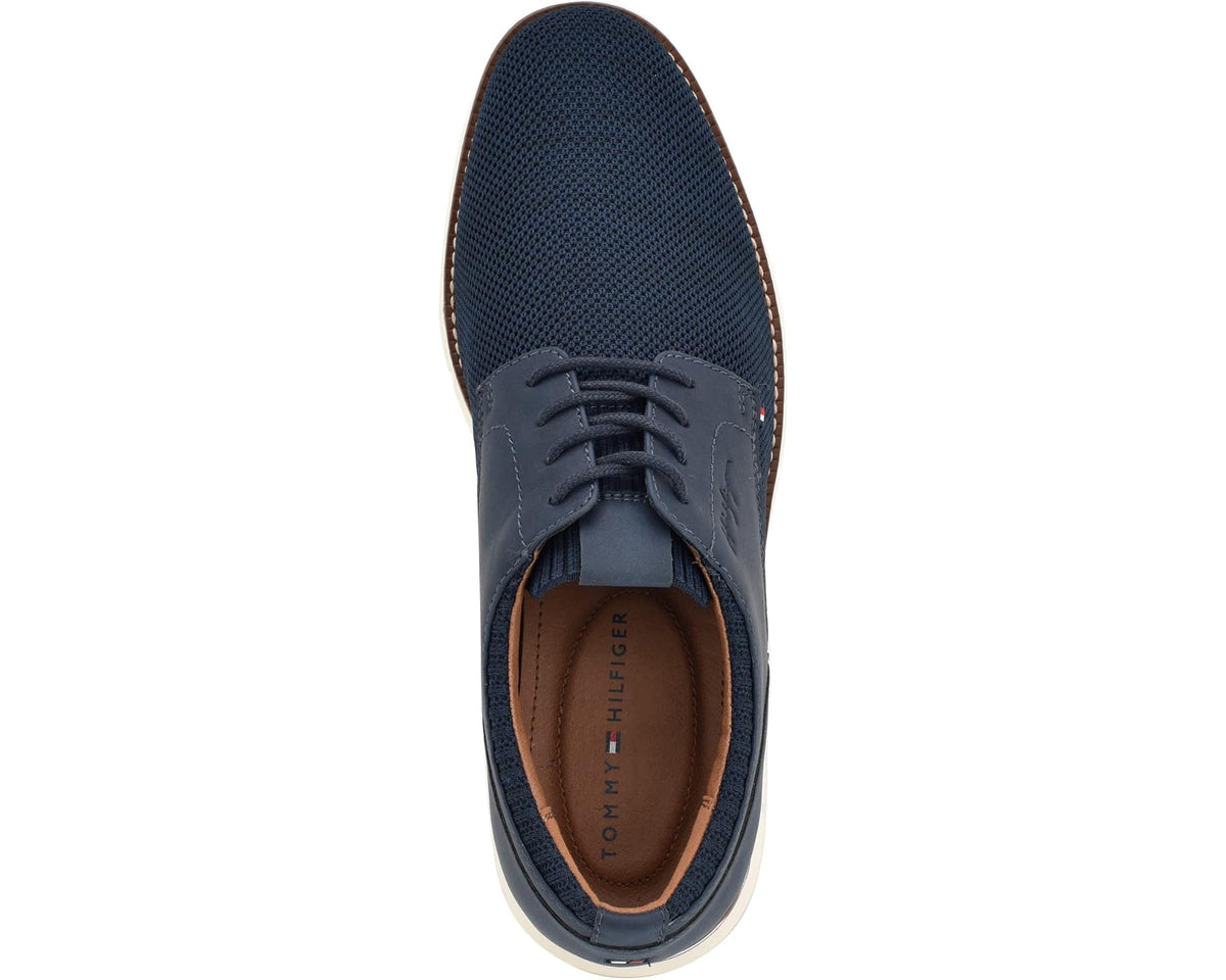 Navy lace-up shoe with brown-lined interior and textured fabric upper